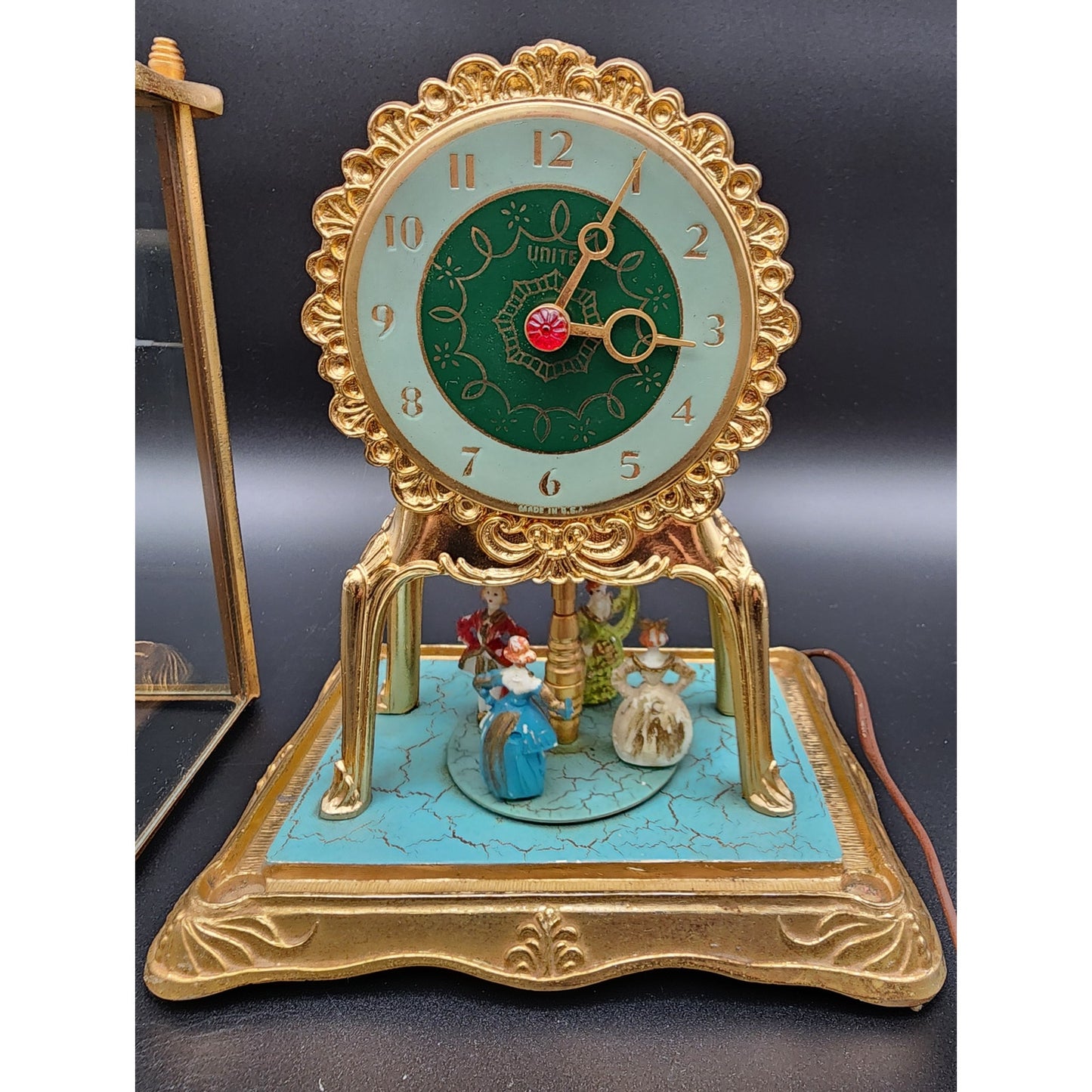 Vintage United Model 990 Brass Clock w/ Dancing Figurines & Glass Case Works