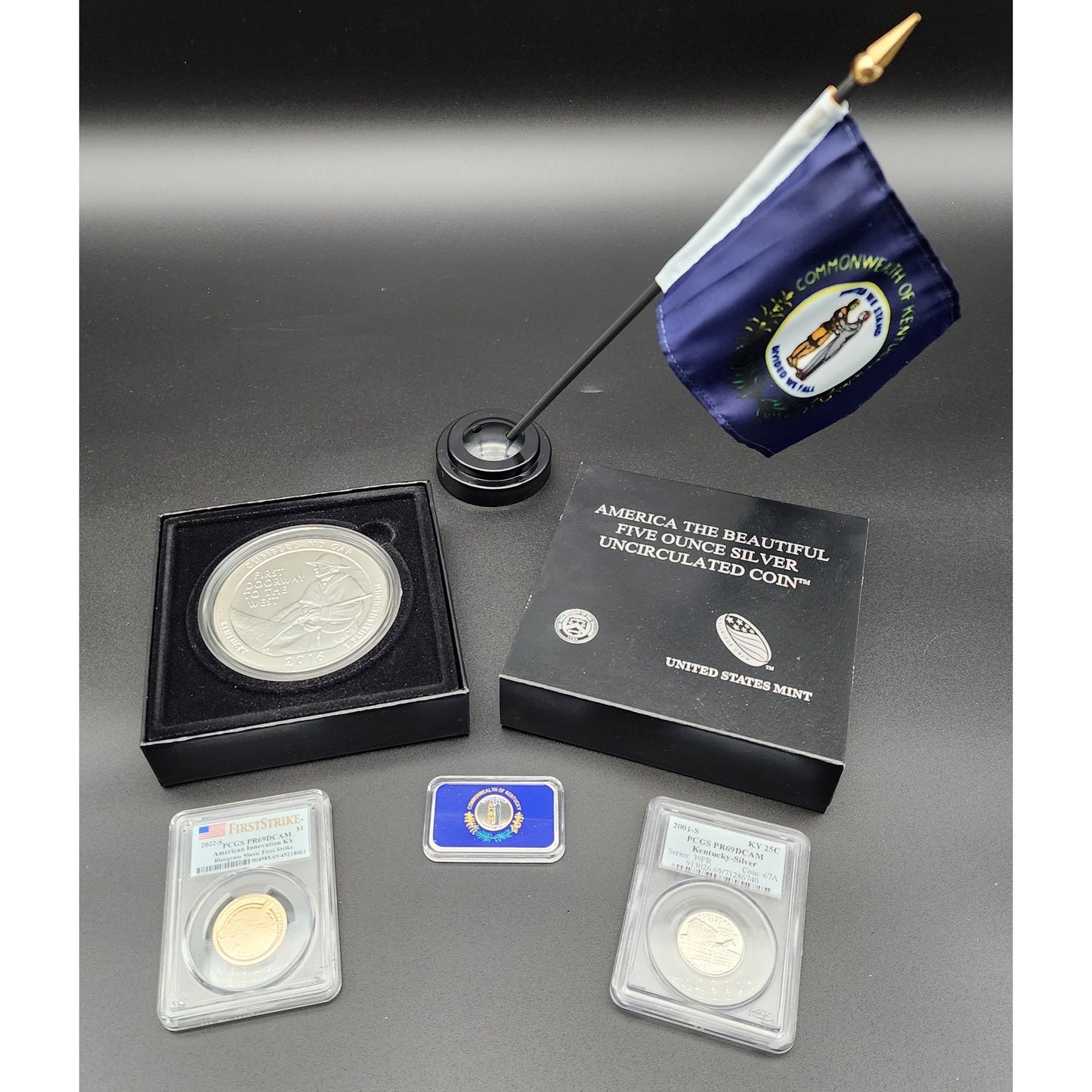 Kentucky Heritage Silver Set: 5oz Cumberland Gap, 1oz Flag Bar, Silver Quarter, $1 Bluegrass Coin